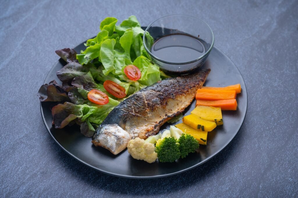 Healthy clean food consisting of grilled saba fish, Variety of vegetables