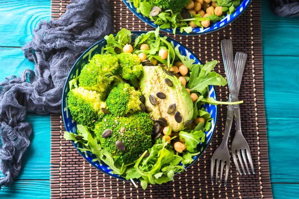 Plant based lunch meal with broccoli and avocado.